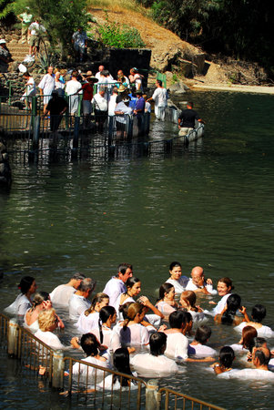 TIBERIAS - MAY 18:Christian pilgrims during mass baptism ceremony at the Jordan River in North Israel on May 18 2009.In Christian tradition, Jesus was baptised in the River Jordan by John the Baptist.のeditorial素材