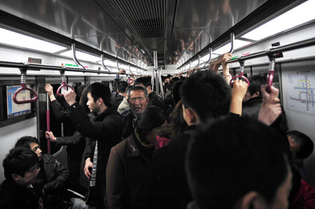 BEIJING - MARCH 14:Crowded scene of Beijing's subway during rush hour on March 14 2009 in Beijing,China.It's transports about 7 million people every day, which is about the total population of Cairoのeditorial素材