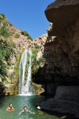 EIN GEDI, ISR - JUNE 07  :Visitors swim in Ein Gedi spring on June 07 2009. It's a very famous and popular  oasis on the shore of Israel's Dead Sea, the lowest place on Earth.のeditorial素材
