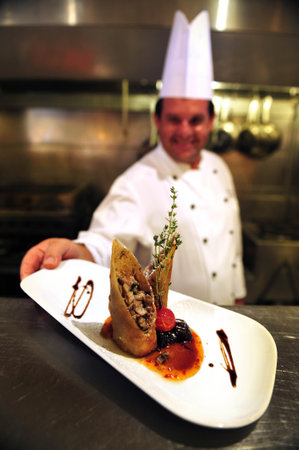 ASHKELON - JULY 27: Chef prepares delicious food in a restaurant on July 27 2009, in Ashkelon, Israel.のeditorial素材