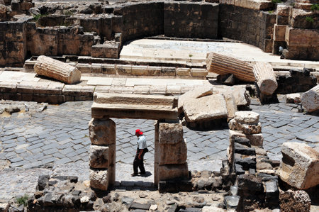 BEIT SHEAN,ISR - JUNE 17:Visitor walks near Pillars in Ancient Beit Shean on June 17 2009.Beit She'an is one of the most ancient sites in Israel: it was first settled 5-6 thousand years ago.のeditorial素材