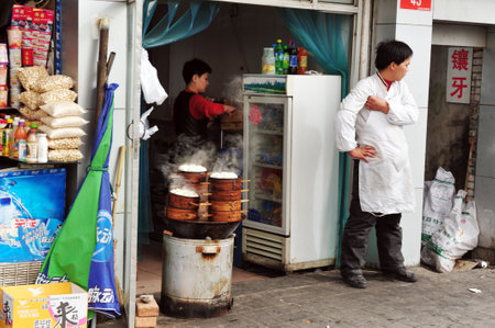 BEIJING - MARCH 15:Chinese dish jiaozi - momo in a restaurant on March 15 2009 in Beijing, China.Millions of Chinese people eat street food every day.のeditorial素材