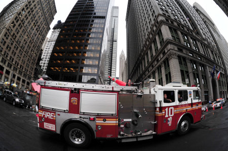 NY - OCT 09:Firemen in Fire truck on October 09 2009 in lower Manhattan New York, USA.The FDNY is...