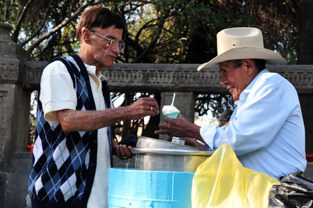 MEXICO CITY - FEB 25: Mexican man sale Vanilla ice cream on February 25 2010  in Mexico City, Mexico.The most popular flavor of ice cream in the world is Vanillaのeditorial素材