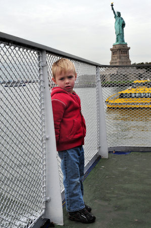 American boy visit at the Statue of liberty Manhattan, New York, USA.のeditorial素材