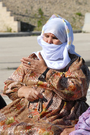 EREZ CROSSING, ISR - Muslim woman covered in burqa on Feb 11 2010.In some European countries It's illegal to wear a face-covering veil in public places such as:street, shops and public transportation.のeditorial素材