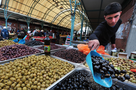 SDEROT - DEC 29:Olives on display on Dec 29 2009 in Sderot market, Israel.The olive tree is the oldest known cultivated tree in history originated in the Eastern part of the Mediterranean sea.のeditorial素材