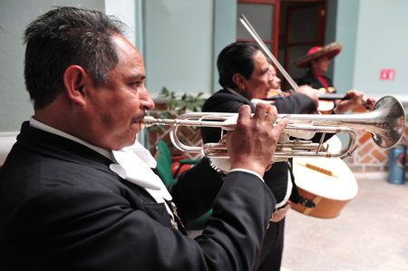 PUEBLA - FEB 25 :Mariachi band play mexican music on February 25 2010 in Puebla, Mexico. It's Mexican musical tradition that dates back to the 19th centuryのeditorial素材
