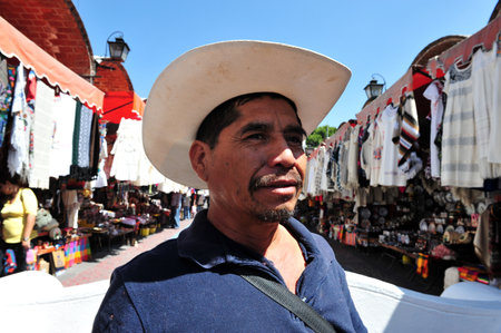 MEXICO CITY - FEB 25: Mexican man at the Artist Market on February 25 2010 in Puebla City, Mexico.Mexican men still expect to provide, protect, and make most decisions for their families.のeditorial素材