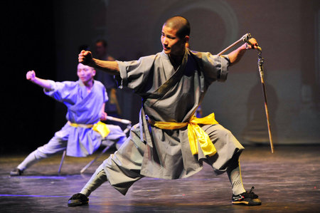 HENAN - JAN 13: Shaolin monks feature Kung Fu martial arts fight on January 13 2011 in Henan Province, China. It collection of Chinese martial arts that claim affiliation with the Shaolin Monastery.のeditorial素材