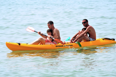 ASHKELON - APR 03:Israeli fathers and children on Kayak on Apr 03 2010.The population of children...