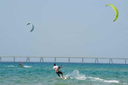 ASHKELON - JAN 29: Kitesurfer is kite boarding on January 29 2011 in Ashkelon, Israel.In 2012, the number of kitesurfers estimated to 1.5 million persons world wide.のeditorial素材