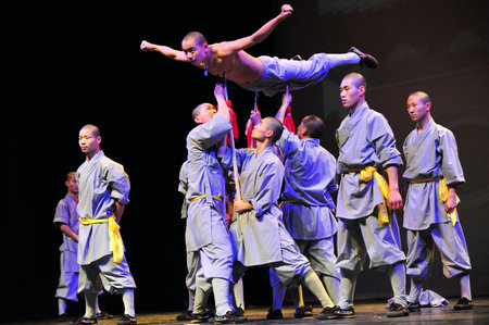 HENAN - JAN 13: Shaolin monks feature Kung Fu martial arts fight on January 13 2011 in Henan Province, China. It collection of Chinese martial arts that claim affiliation with the Shaolin Monastery.のeditorial素材