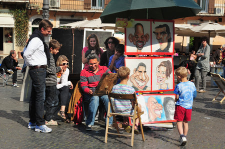 ROME - APRIL 28:Street artist paint caricatures in Piazza Navona on April 28 2011 in Rome, Italy.Built in 1st century AD,follows the form of a stadium and the ancient Romans came there to watch games.のeditorial素材