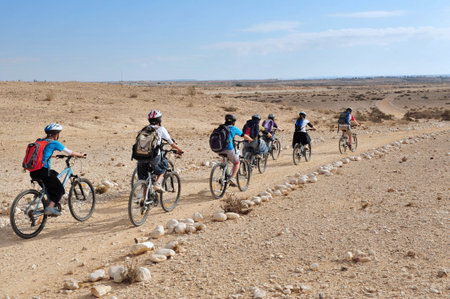 NEGEV,ISR - MAY 31:People cycle over the wilderness of the Negev Desert on May 31 2009.Various peoples have lived in the Negev since the dawn of history such as:Nomads, Canaanites, Nabateans and Israelis.のeditorial素材