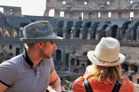 ROME - APRIL 29:A couple visit at the Colosseum on April 29 2011 in Rome Italy.It has been estimated that over 500,000 people and over a million animals were killed there.のeditorial素材