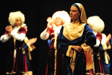 ASHDOD - MARCH 08: Georgian dancers dancing a folklore dance show on stage on March 08 2010 in Ashdod, Israel.It's a mountain dance that best representative of the Georgian people spirit.のeditorial素材