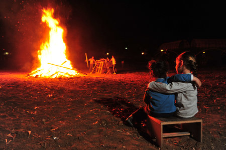 Israeli youth celebrate by a bonfire the Jewish holiday of Lag Baomer, a festive day on the Jewish calendar to commemorate the death of Rabbi Shimon Bar Yochai.のeditorial素材