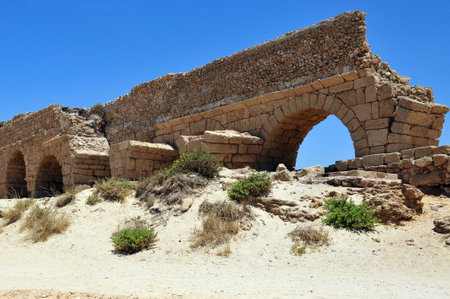 The ancient Roman aqueduct at Ceasarea along the coast of the Mediterranean Sea, Israel.のeditorial素材