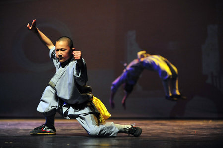 HENAN - JAN 13: Shaolin monks feature Kung Fu martial arts fight on January 13 2011 in Henan Province, China. It collection of Chinese martial arts that claim affiliation with the Shaolin Monastery.のeditorial素材