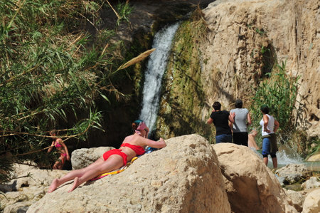 EIN GEDI, ISR - MAR 18 :Visitors in Ein Gedi spring on March 18 2009. It's a very famous and popular  oasis on the shore of Israel's Dead Sea, the lowest place on Earth.のeditorial素材