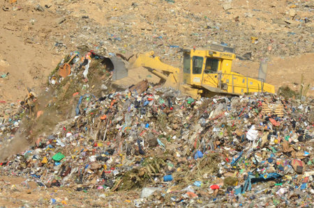 SOUTH ISRAEL, NOVEMBER 1, 2011. A bulldozer clears garbage in a recycling center.のeditorial素材