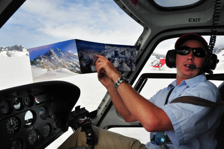 FOX GLACIER, NZ - MAR 07:Helicopter pilot to Fox Glacier on March 07 2009,NZ.It's a 13 km 8.1 mi long glacier located in Westland National Park on the West Coast of New Zealand's South Islandのeditorial素材