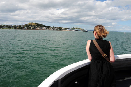 AUCKLAND - APRIL 19:Passenger on a ferry boat from Auckland to Devonport on April 19 2012 New Zealand.It's the largest and most populous urban area in NZ with 1,397,300 residents.のeditorial素材