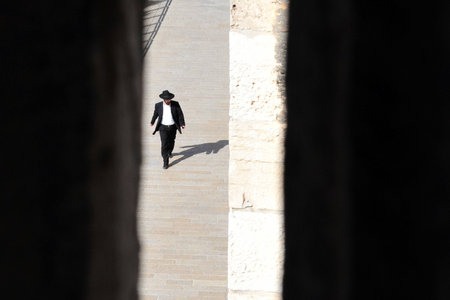 JERUSALEM - NOV 05:Orthodox Jewish man at the Jewish quarter on November 05 2010 Jerusalem,Israel.The quarter is inhabited by around 2,000 residents and is home to numerous yeshivas and synagogues.のeditorial素材