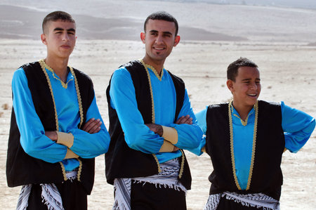WESTERN NEGEV-DECEMBER 13:Bedouin arab men wear traditional kufeyas dancing clothing on December 13 2011.Negev Bedouin are formerly nomadic and later also semi-nomadic Arabs who live by rearing livestock in the deserts of southern Israel.のeditorial素材
