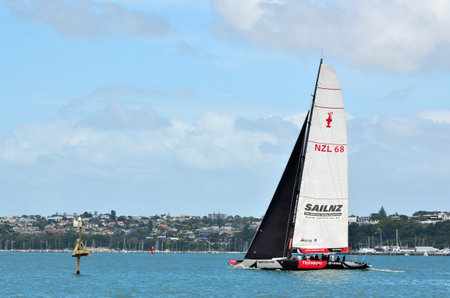 AUCKLAND, NEW ZEALAND - JANUARY 31 2012: The Team New Zealand TNZ sailing team yacht who based in Auckland, New Zealand as seen from Devon Port on January 31 2012.のeditorial素材
