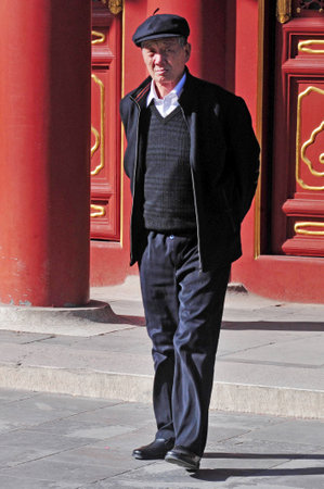 BEIJING - MAR -13: Chines man visiting at The Lama Temple on March 13 in Beijing, China.It's one of the largest and most important Tibetan Buddhist monasteries in the world.のeditorial素材