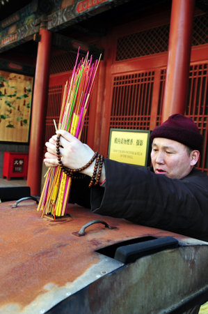 BEIJING - MAR -13: Buddhist tibetan monk in the Lama Temple on March 13 Beijing, China.It is one of the largest and most important Tibetan Buddhist monasteries in the world.のeditorial素材
