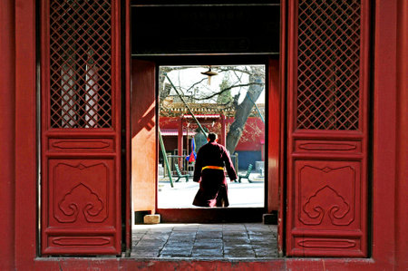 BEIJING - MAR -13: Buddhist tibetan monk in the Lama Temple on March 13 2009 in Beijing, China.It is one of the largest and most important Tibetan Buddhist monasteries in the world.のeditorial素材