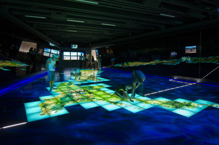 WELLINGTON - MAR 02:Visitors on interactive map of New Zealand in Te Papa Museum on March 02 2013.Over 10 million visitors visit Te Papa New Zealand National Museum in Wellington since opening in 1998.のeditorial素材