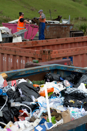 KAITAIA, NZ - NOV 05:Recycle station workers on Nov 05 2013.Recycling has been a common practice for...