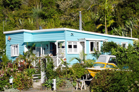 WHANGAROA HARBOUR - NZ - FEB 13:Remote batch holiday house on February 13 2013 in Whangaroa Harbour , New Zealand. More than 50,000 baches exist around New Zealand and they are an iconic part of NZ history and culture.のeditorial素材