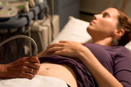 KAITAIA, NZ - NOV 05:Ultrasound scanning in the x-ray lab on Nov 05 2013.A pregnancy ultrasound is an imaging test that uses sound waves to see how a baby is developing in the womb.のeditorial素材