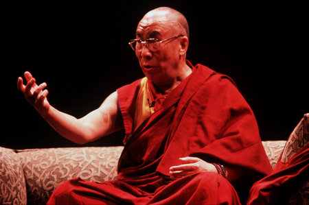 AUCKLAND - APRIL 10 2003: His Holiness the 14th Dalai Lama of Tibet is giving a speech in Auckland  New Zealand in April 10 2003. He has lived in exile in India since the Chinese Army crushed an uprising in his homeland in 1959.のeditorial素材