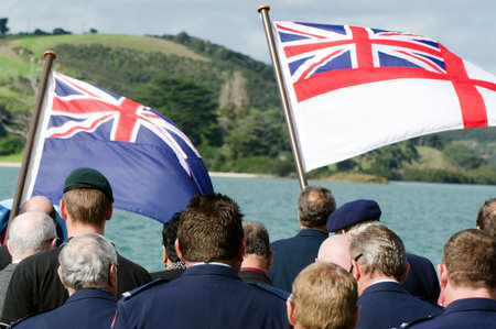 The national flags of England and New Zealand In a National War Memorial during Anzac Day Services in New Zealand.のeditorial素材