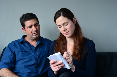 Couple planning their life the living room. Spouse relationship conceptの写真素材
