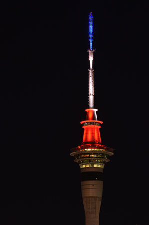 AUCKLAND NEW ZEALAND NOV 14 2015: Tonight Auckland's Sky Tower has lit up in the colours of the...