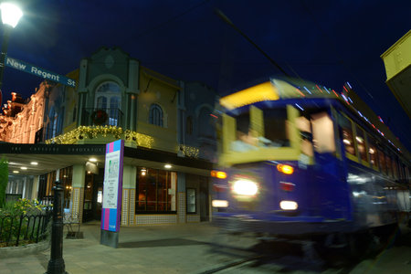 CHRISTCHURCH - DEC 08 2015:Tram pass on New Regent Street at night. Christchurch's beloved New Regent Street is reclaiming its place as a one of the most popular shopping and visitor destinationのeditorial素材