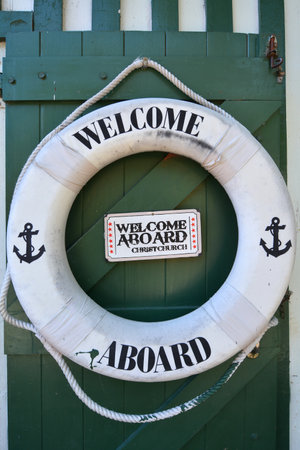 CHRISTCHURCH - DEC 04 2015:Welcome aboard sign on a life saving wheel of Punting on the Avon river Christchurch.It is an iconic tourist attraction of Christchurch, New Zealand.のeditorial素材