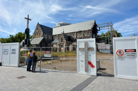 CHRISTCHURCH - DEC 04 2015:Visitors at ChristChurch Cathedral.The 2011 Christchurch earthquake destroyed the spire and part of the tower, and severely damaged the structure of the remaining building.のeditorial素材