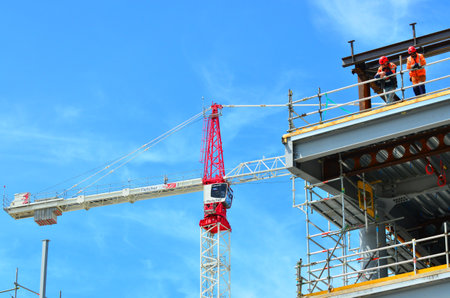 CHRISTCHURCH - DEC 04 2015:Builders builds a new building in Christchurch.Over 1000 buildings in the CBD (Central Business District) were demolished following Christchurch earthquakesのeditorial素材