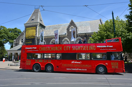 CHRISTCHURCH,  NZL - DEC 04 2015:Christchurch tour bus outside the Canterbury Museum.The bus tours the city thorough Christchurch landmarks and earthquake destruction sites.のeditorial素材