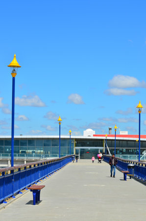 CHRISTCHURCH - DEC 07 2015:Visitors on New Brighton Pier in Christchurch. The pier is one of Christchurch main tourist attractions, spanning 300 meters long, it is the longest pier in the Australasiaのeditorial素材