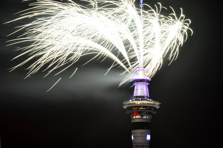 AUCKLAND,  NZL -  JAN 01 2016:Auckland Sky Tower displaying a spectacular firework display to celebrate 2016 New Year.New Zealand is one of the first countries to observe the New Year.のeditorial素材