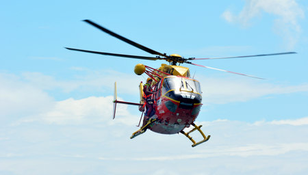 AUCKLAND,  NZL - JAN 30 2016:Westpac Rescue Helicopter crew in rescue mission.The crew are trained...